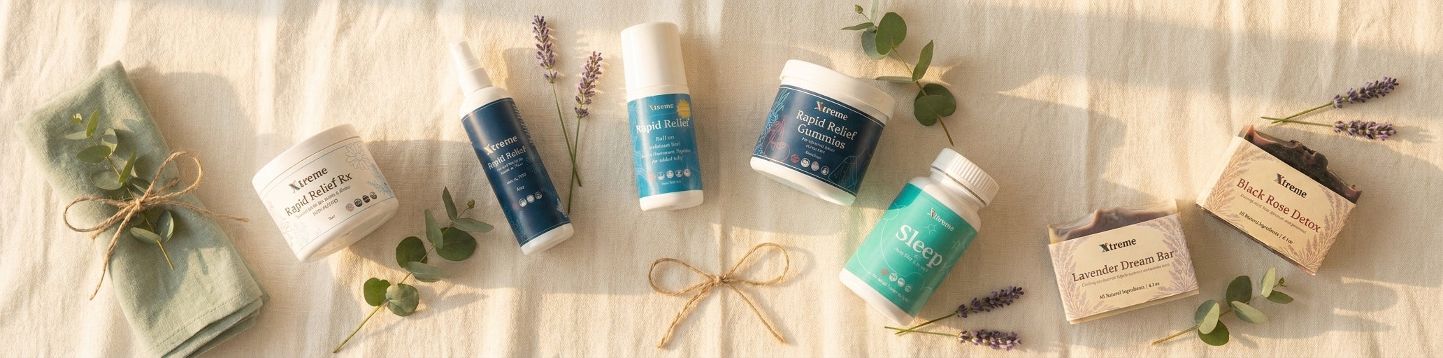 Collection of wellness gifts for moms including recovery balm, sleep softgels, artisan soap and gummies