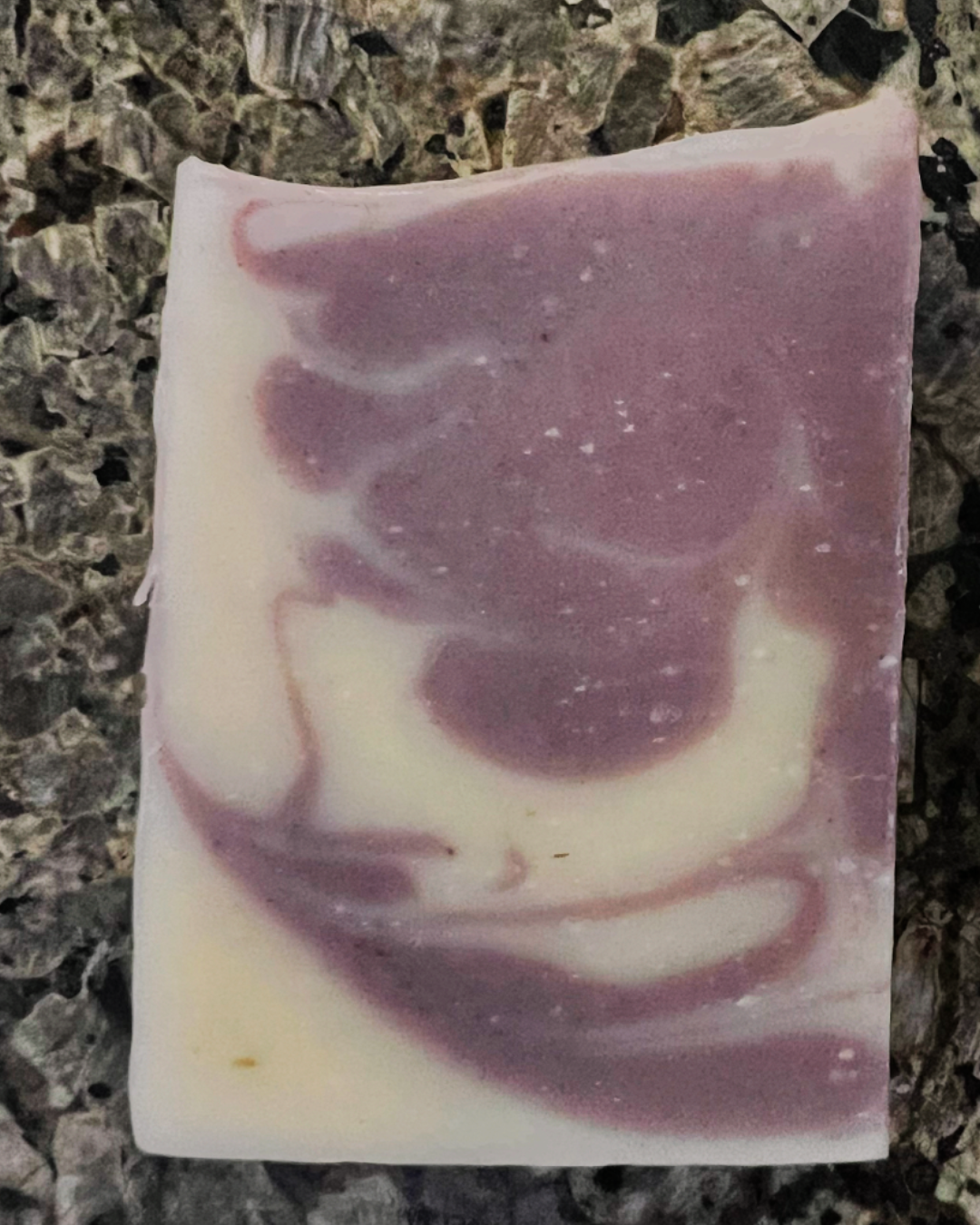 Close-up of Lavender Dream handmade soap bar – natural artisan bar with lavender buds for a calming, aromatic cleanse.