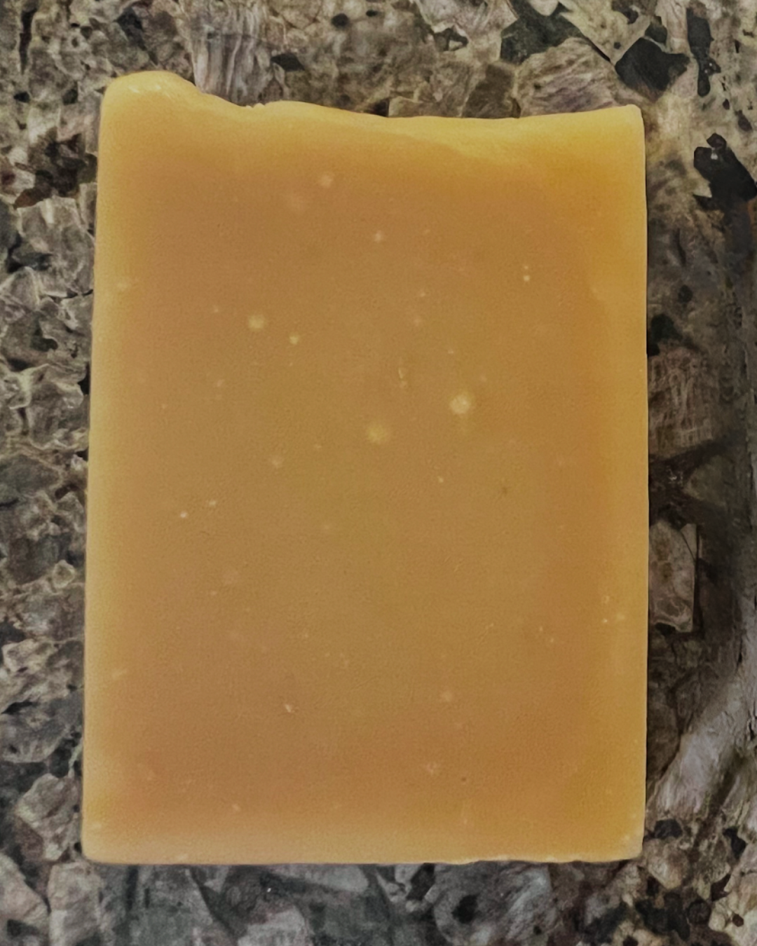 Close-up of Golden Glow handmade soap – natural artisan bar with turmeric and citrus for brightening and refreshing skin.
