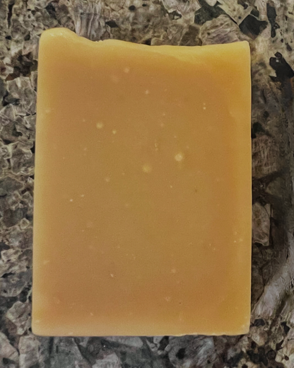 Close-up of Golden Glow handmade soap – natural artisan bar with turmeric and citrus for brightening and refreshing skin.
