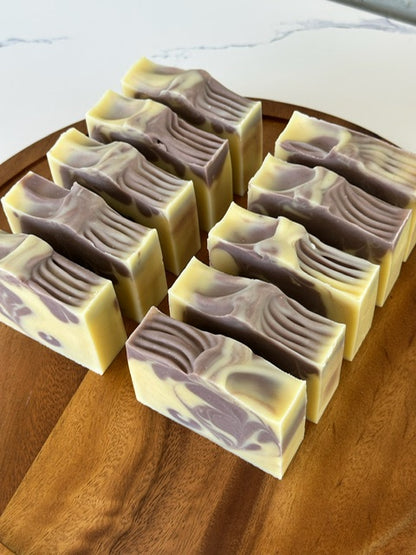 Handmade Lavender Dream Bar soap loaf with natural lavender buds, crafted in small batches for calming, aromatic skin care.
