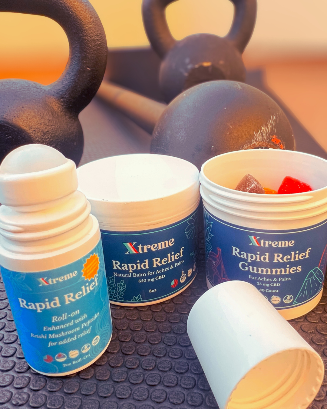 Xtreme Brands Recovery Bundle – RX Rapid Relief Balm, RX Rapid Relief Spray, and Functional Mushroom Roll-On in a gym setting for active recovery and pain relief.

